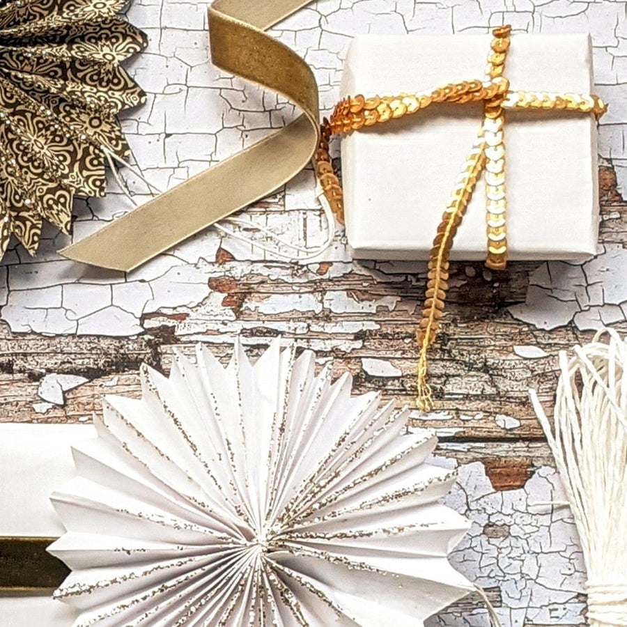 gold sequin ribbon on white gift wrap